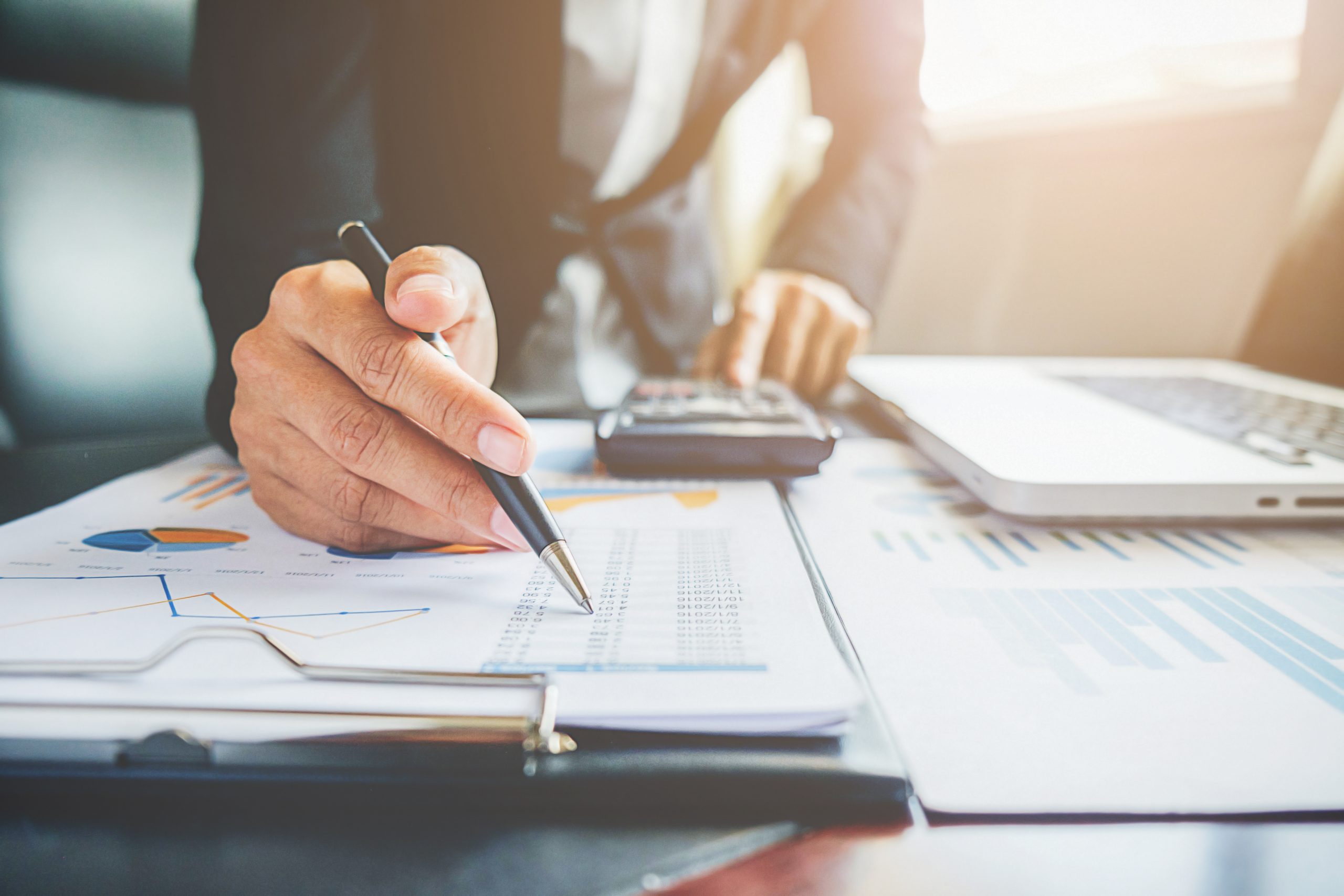 Financial planning papers and a calculator on a desk