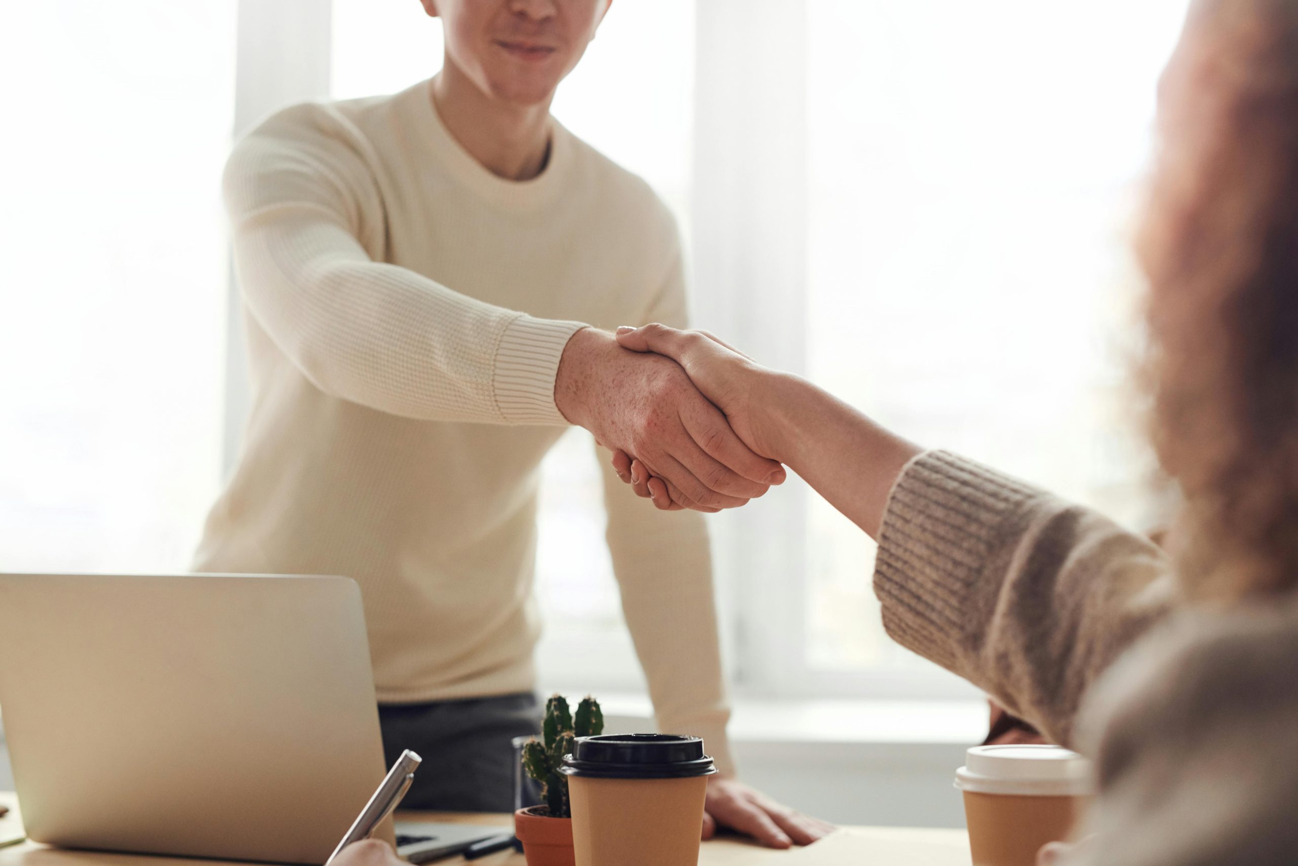 Professionals shaking hands after a meeting